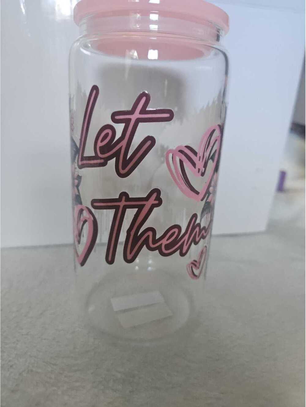 16 oz glass cup with acrylic Lid. Comes w/ straw and straw cleaner.